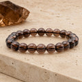 Bracelet Cristal de Roche Fumé 8 mm – Calme de la Retenue