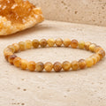 Bracelet Œil de Tigre Doré 6 mm – Racines Douces